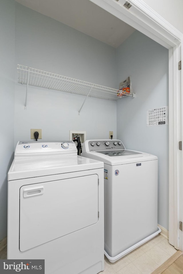 laundry room with washer and dryer