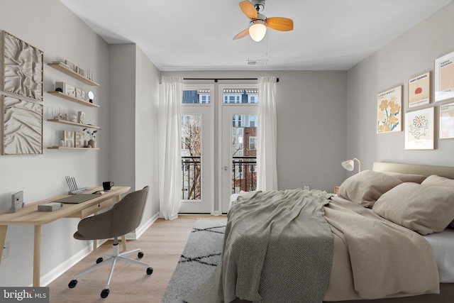 bedroom with light hardwood / wood-style flooring, access to outside, and ceiling fan