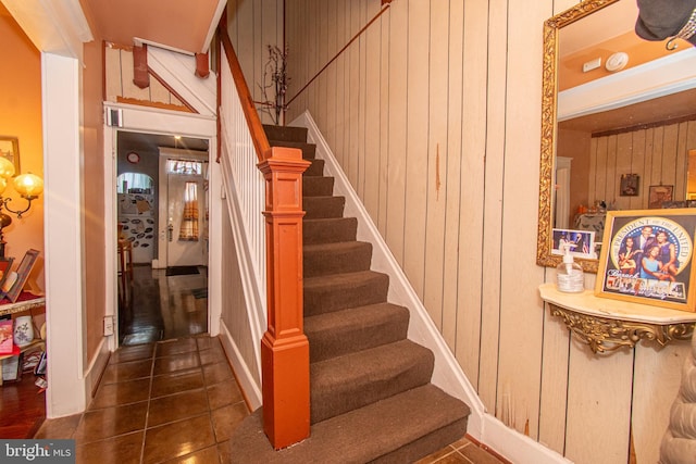 stairs with wood walls