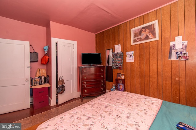 tiled bedroom with wood walls