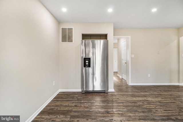 unfurnished room featuring dark hardwood / wood-style flooring