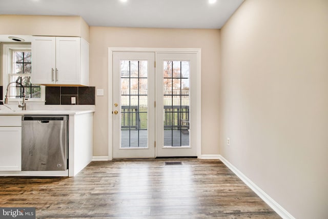 doorway featuring sink and wood-type flooring