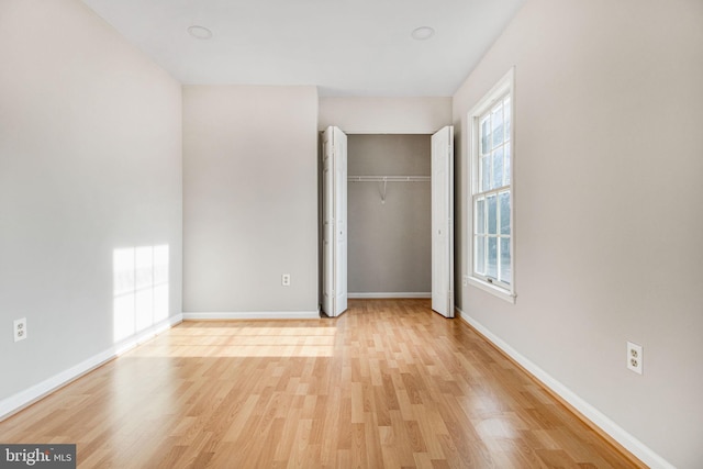 unfurnished bedroom featuring light wood-type flooring