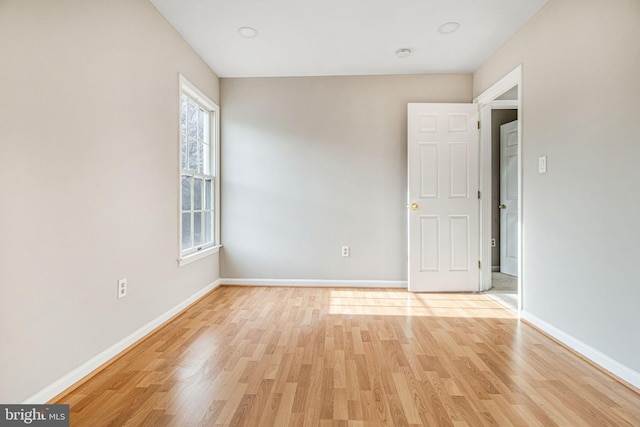 spare room featuring light wood-type flooring