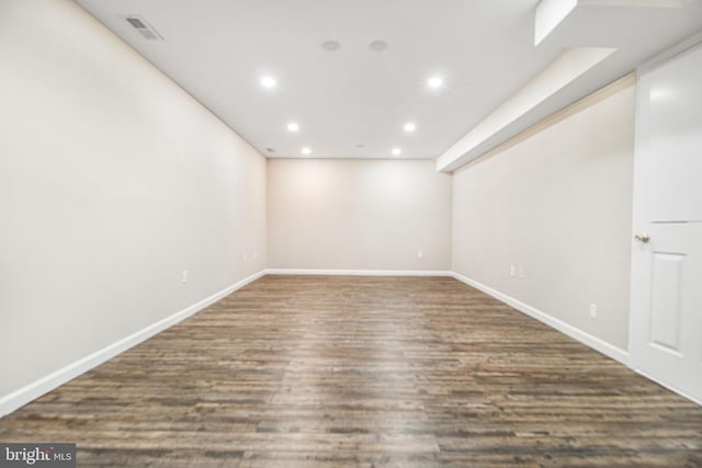 basement featuring dark hardwood / wood-style floors