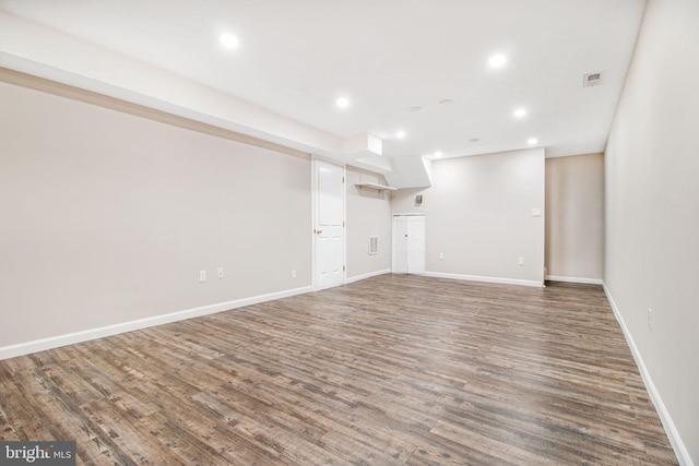 unfurnished living room featuring hardwood / wood-style flooring