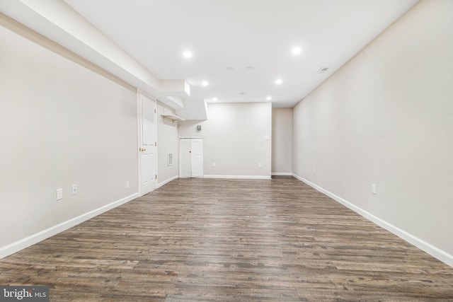 basement with dark wood-type flooring