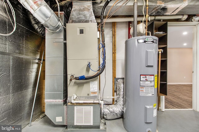 utility room featuring water heater and heating unit