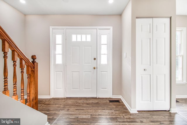 foyer with hardwood / wood-style flooring and a healthy amount of sunlight