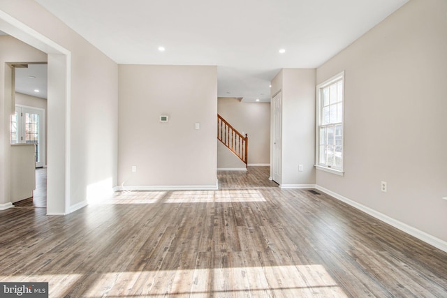 spare room with wood-type flooring