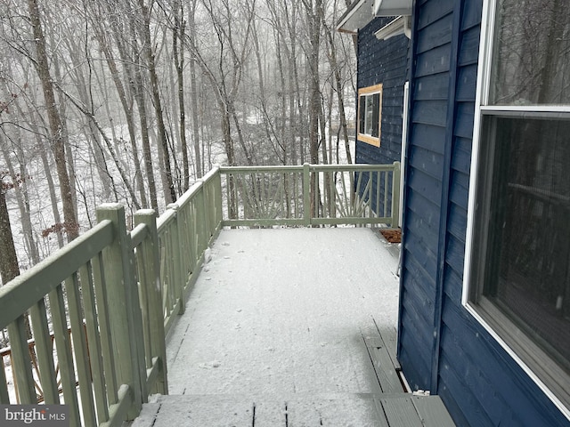 view of snow covered deck