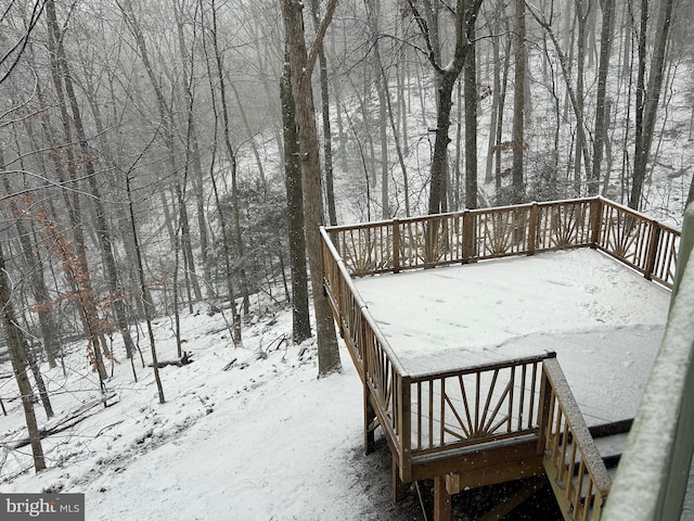 view of snow covered deck