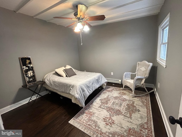 bedroom featuring wood-type flooring, a baseboard radiator, and ceiling fan