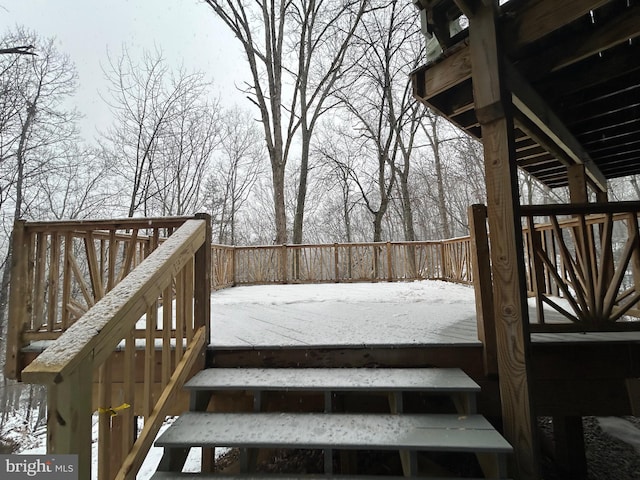 view of snow covered deck