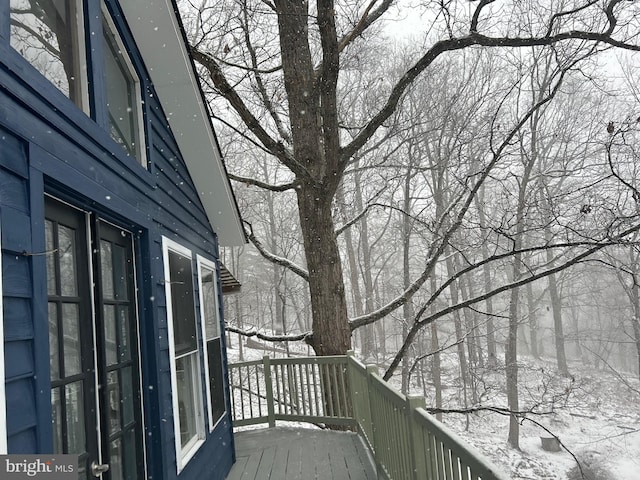 view of snow covered deck