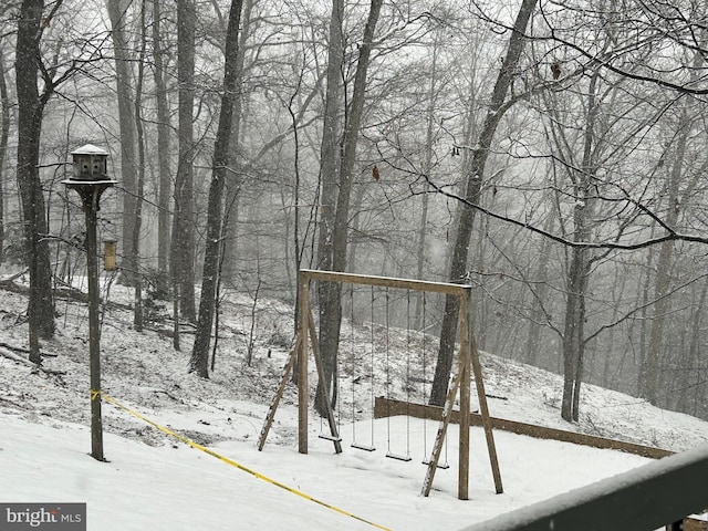 view of yard layered in snow