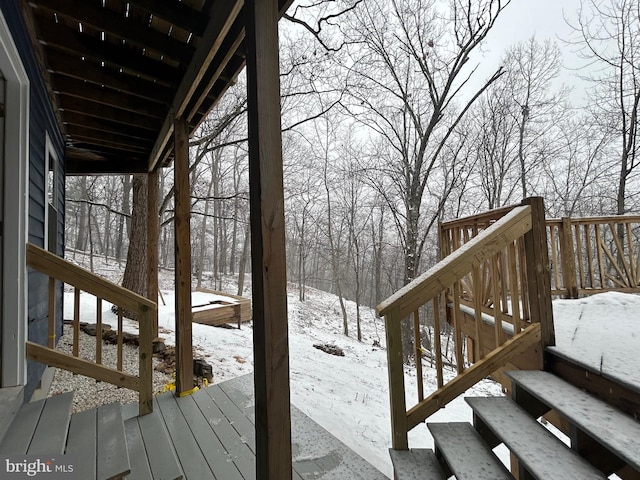 view of snow covered deck