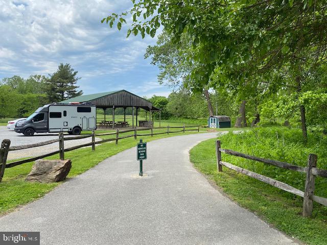 view of community with a gazebo and a storage unit