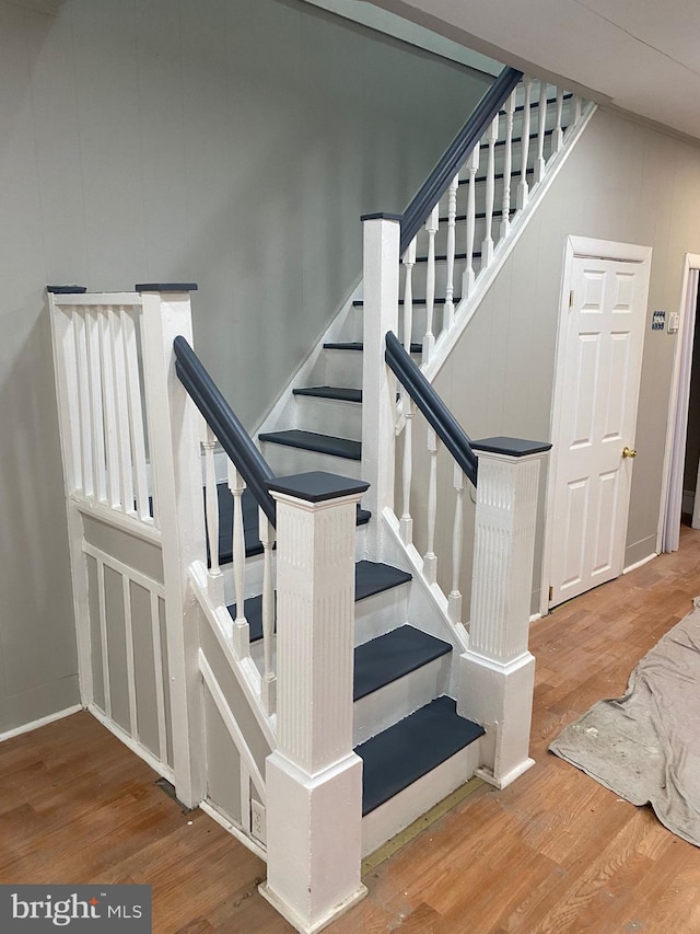 stairway featuring hardwood / wood-style flooring