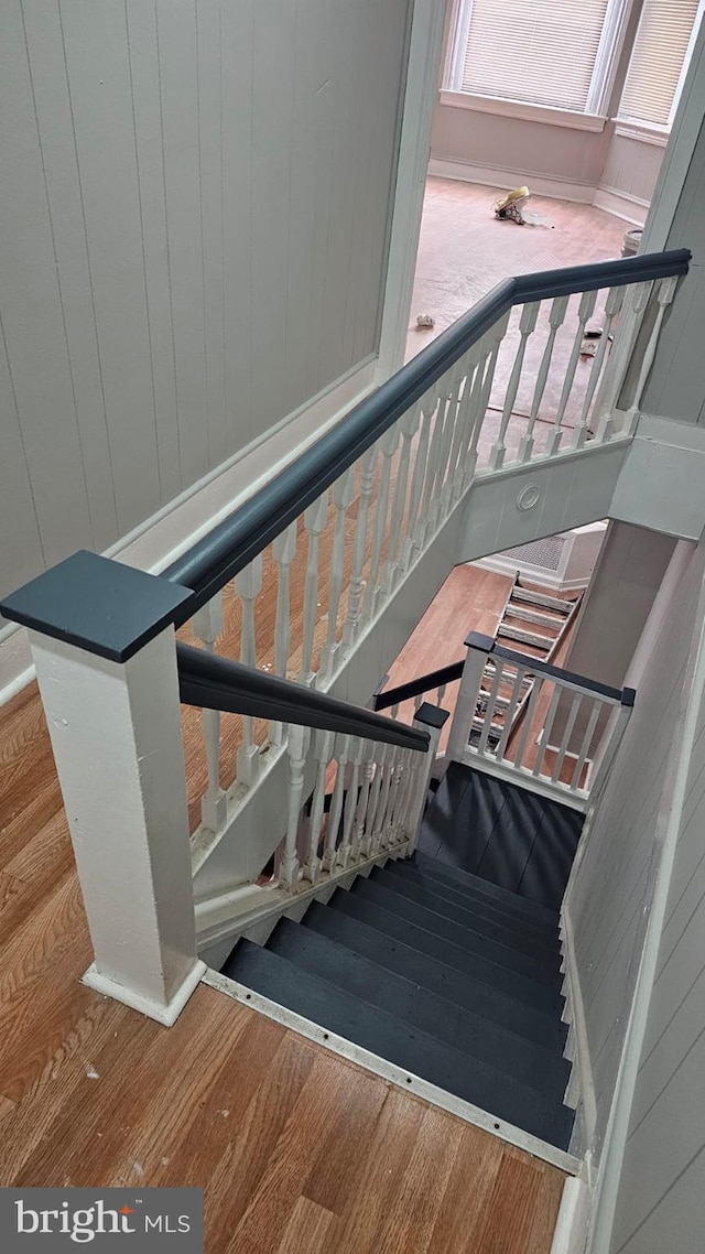 staircase featuring wood-type flooring