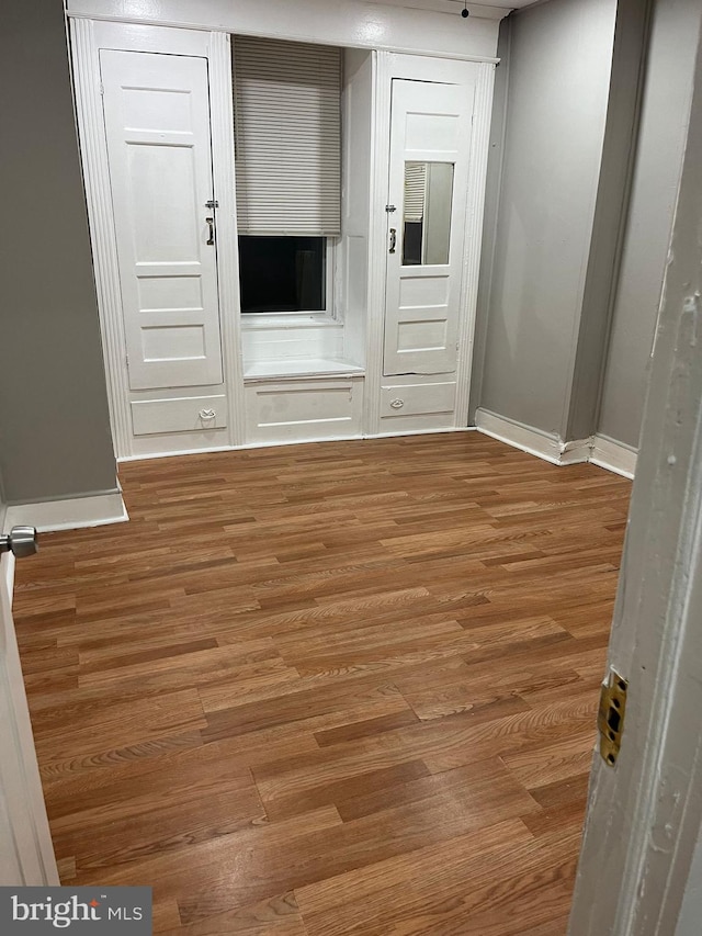 spare room featuring hardwood / wood-style flooring