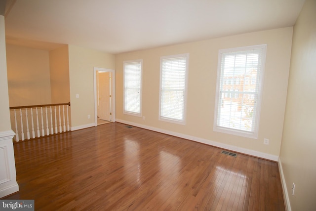 empty room featuring wood-type flooring