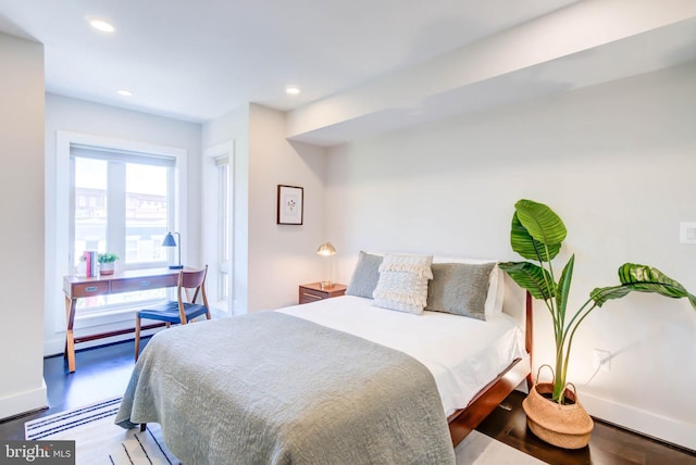 bedroom with wood-type flooring