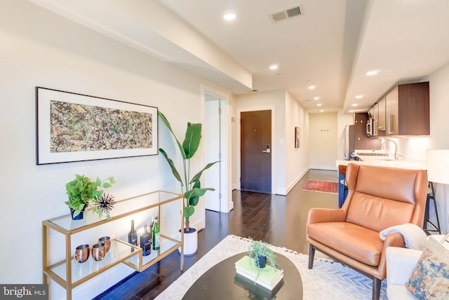 living room featuring dark hardwood / wood-style flooring