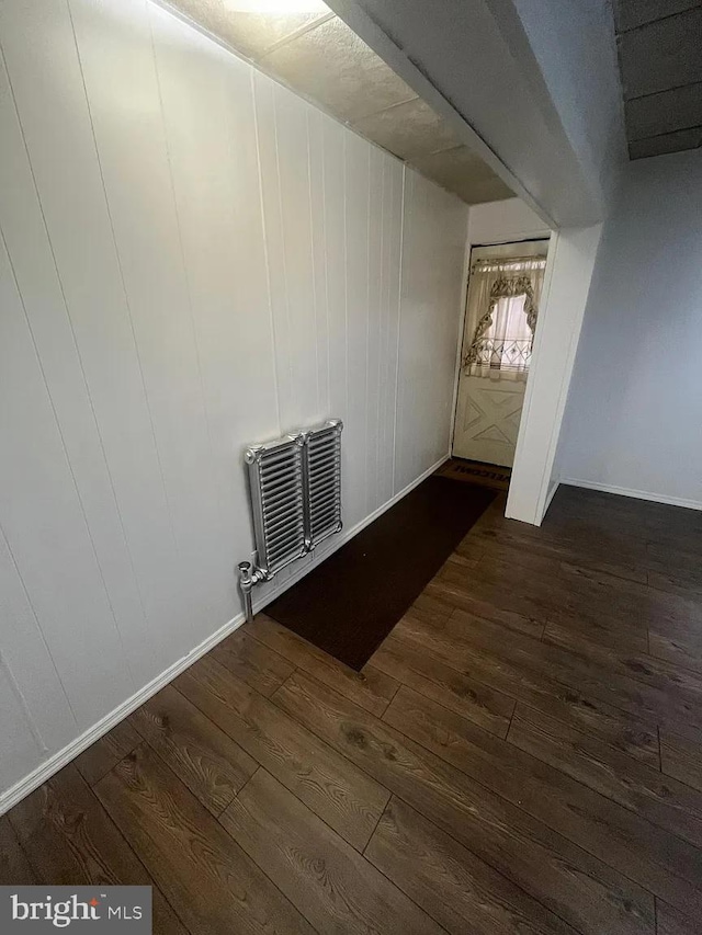 spare room with dark hardwood / wood-style floors