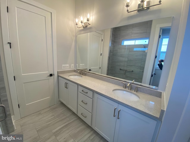 bathroom featuring an enclosed shower and vanity