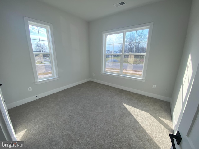 empty room featuring carpet flooring