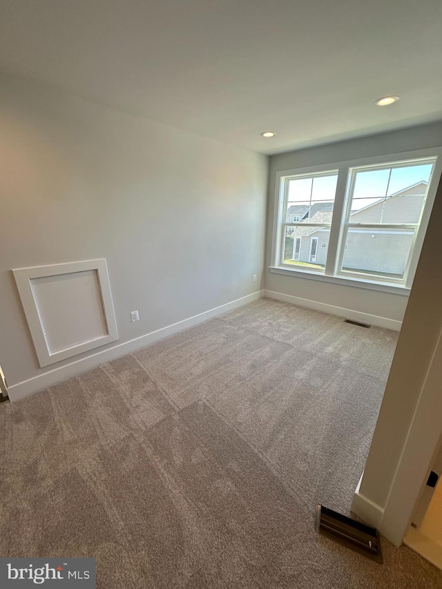 view of carpeted spare room