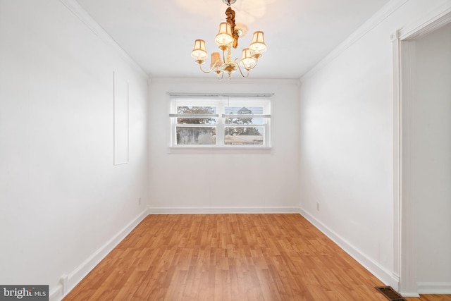 unfurnished dining area featuring ornamental molding, a notable chandelier, and light hardwood / wood-style floors