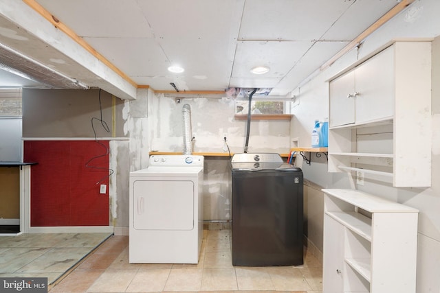 clothes washing area with washer and dryer