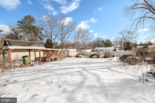 view of yard covered in snow