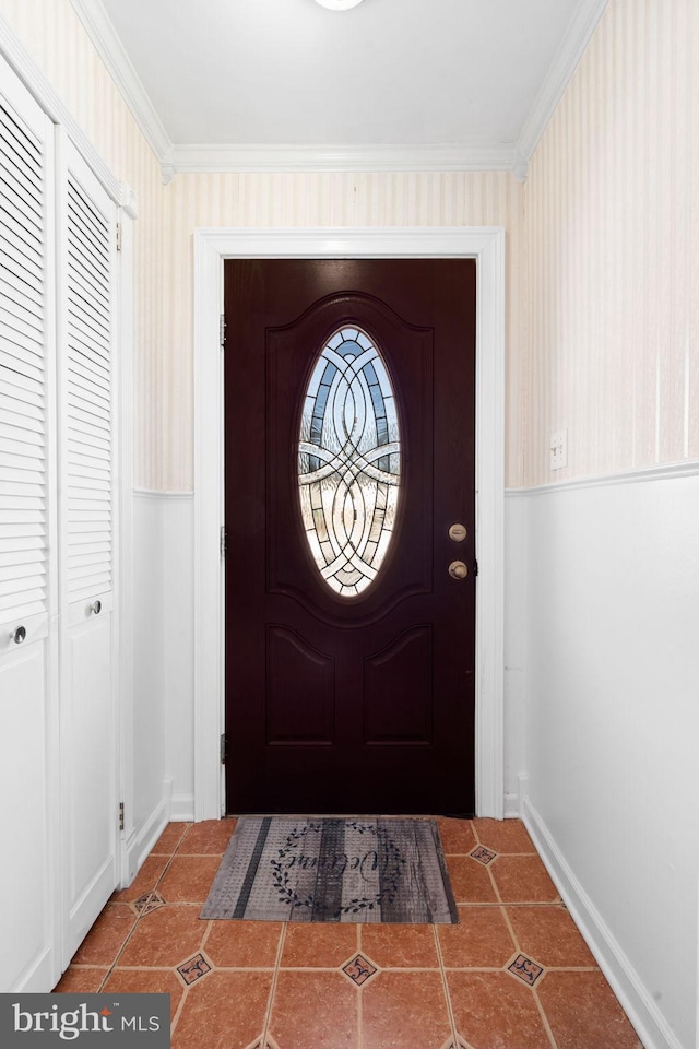 tiled entrance foyer with ornamental molding