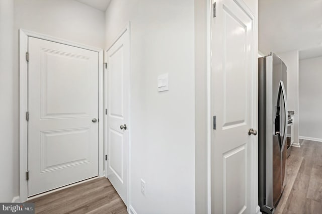 hall with light wood-type flooring