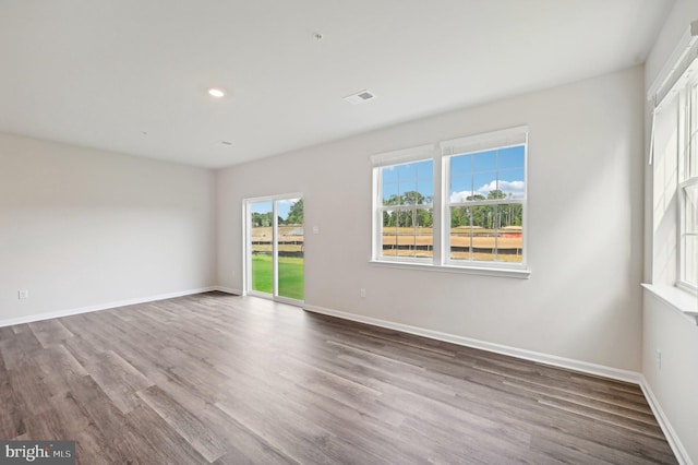 spare room featuring hardwood / wood-style flooring