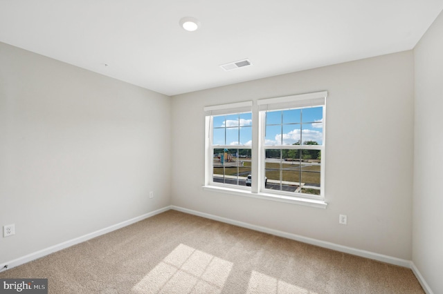 spare room with carpet floors