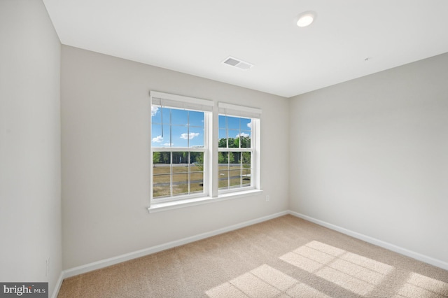 unfurnished room featuring carpet