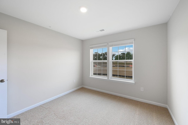 unfurnished room with carpet flooring