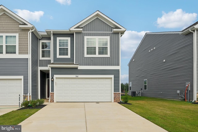 view of front facade featuring central air condition unit, a front lawn, and a garage