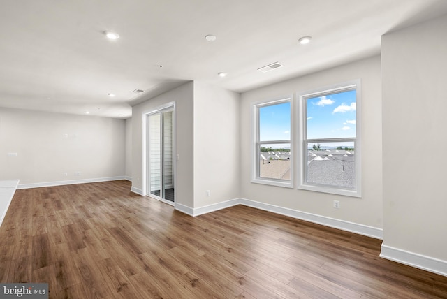 empty room featuring hardwood / wood-style flooring