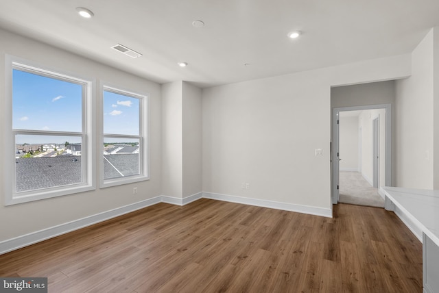 empty room featuring hardwood / wood-style floors