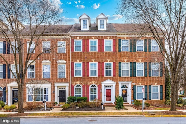 multi unit property featuring brick siding