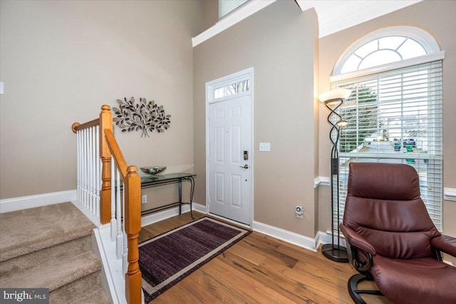 entrance foyer with wood finished floors and baseboards