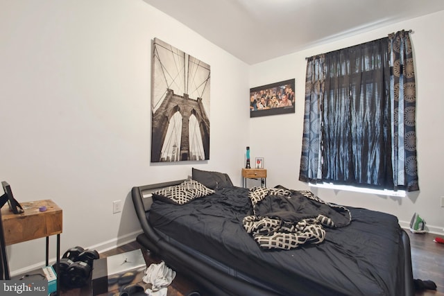 bedroom with wood-type flooring