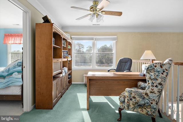 office featuring ceiling fan, carpet floors, a wealth of natural light, and ornamental molding