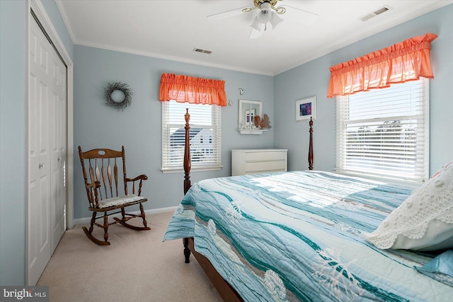 bedroom featuring crown molding, light colored carpet, a closet, and ceiling fan