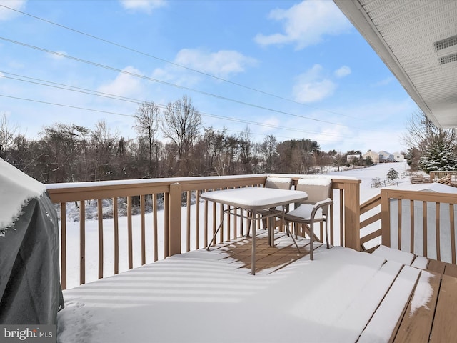 view of snow covered deck